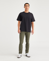 Front view of model wearing Army Green Men's Skinny Fit Smart 360 Flex California Chino Pants.