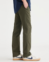 Side view of model wearing Army Green Men's Slim Fit Original Chino Pants.