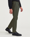 Side view of model wearing Army Green Men's Slim Tapered Fit Crafted Pants.