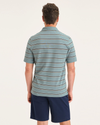 Back view of model wearing Baldwin Stripe Tourmaline Peach Bloom Men's Slim Fit Pique Polo.