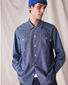 Front view of model wearing Bay Chambray Dockers® x Transnomadica Dock Shirt.