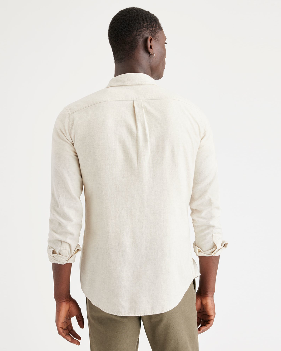 Back view of model wearing Beachstone Heather Men's Slim Fit Icon Button Up Shirt.