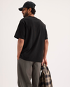 Back view of model wearing Beautiful Black Eighty-Six Crewneck Tee, Relaxed Fit.