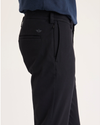 Side view of model wearing Beautiful Black Go Activeflex Chino, Skinny Fit.