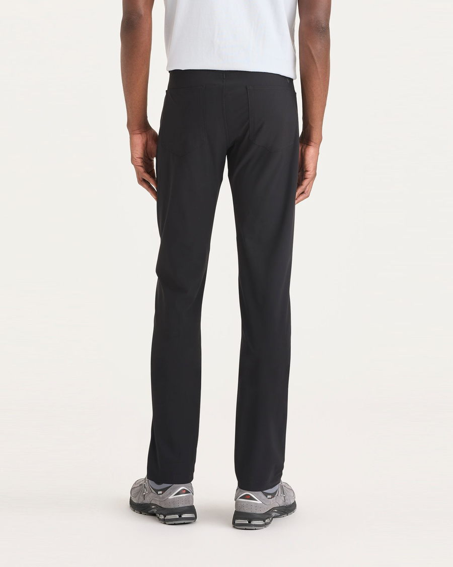 Back view of model wearing Beautiful Black Go Airweave 5-Pocket, Slim Tapered Fit.