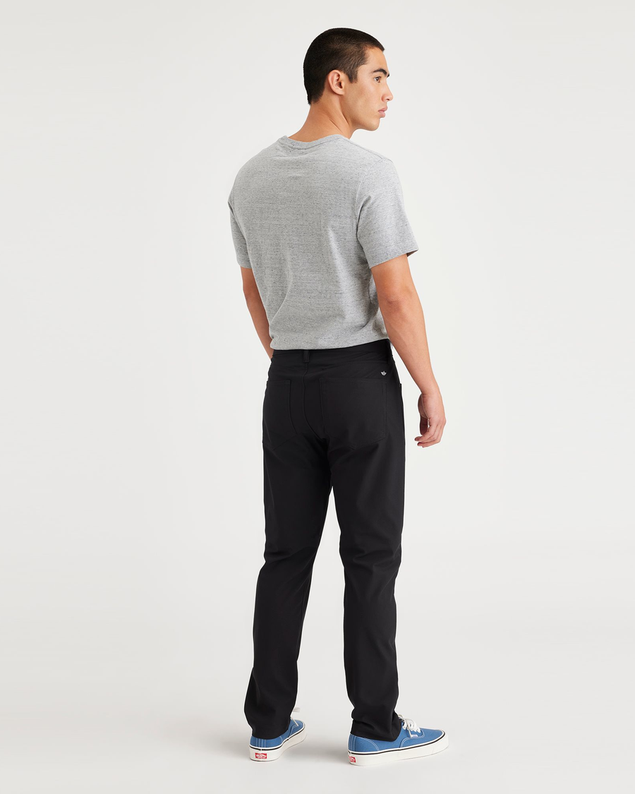 Back view of model wearing Beautiful Black Jean Cut Go, Slim Tapered Fit with Airweave.