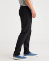Side view of model wearing Beautiful Black Jean Cut Go, Slim Tapered Fit with Airweave.