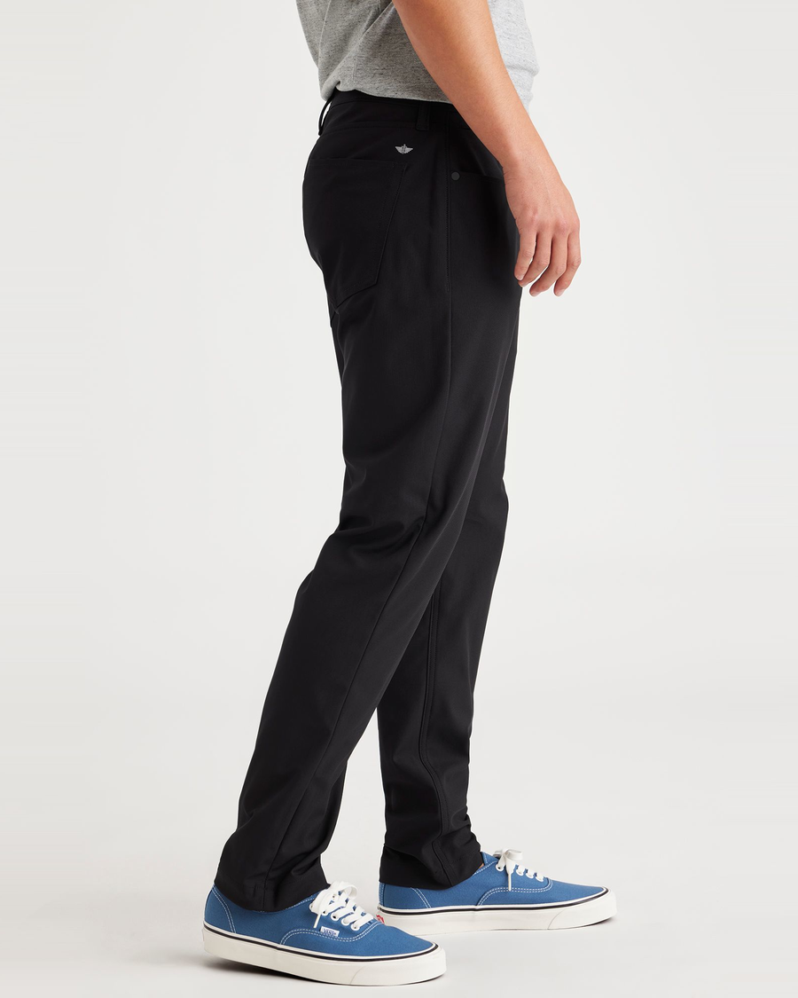 Side view of model wearing Beautiful Black Jean Cut Go, Slim Tapered Fit with Airweave.