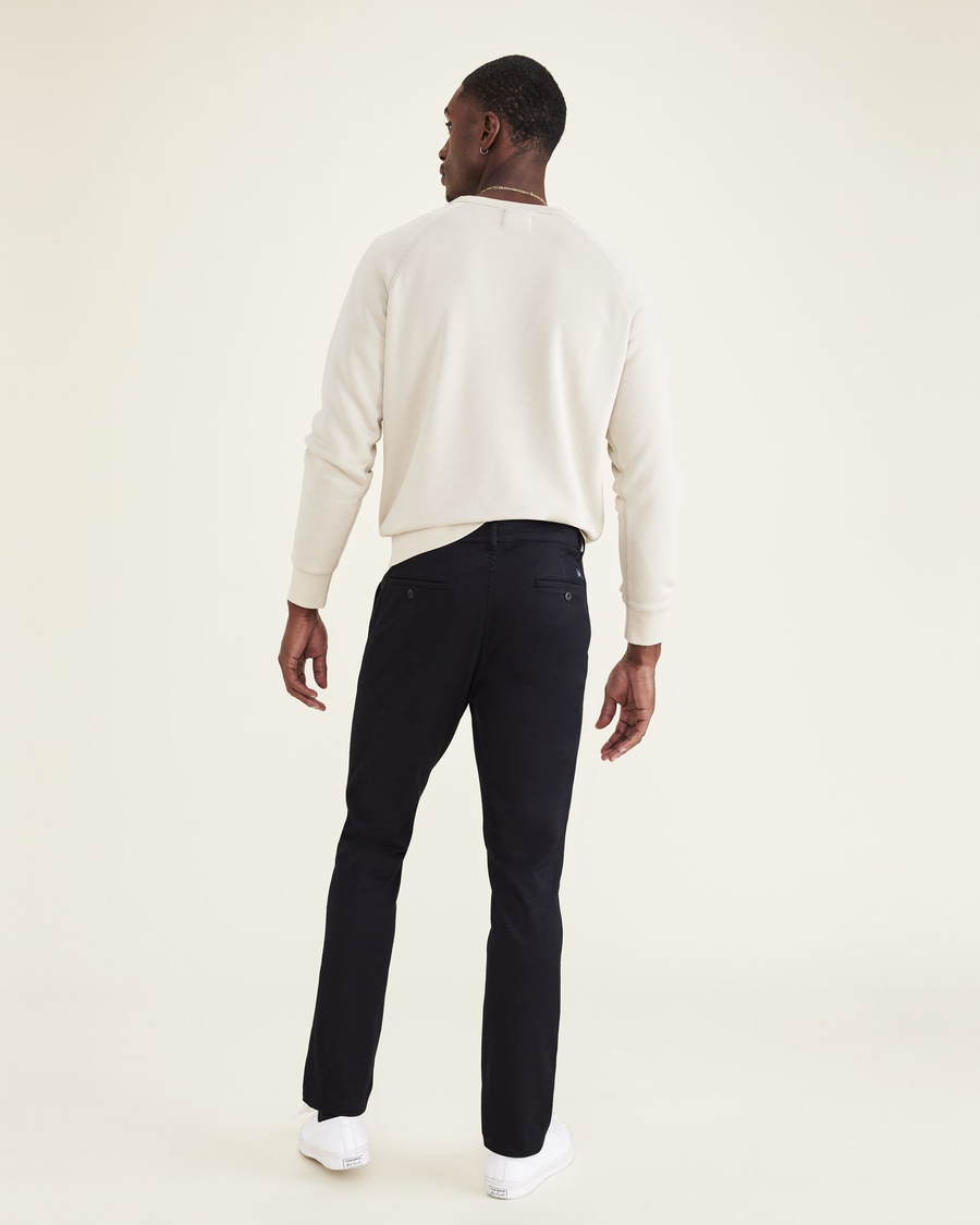 Back view of model wearing Beautiful Black Men's Skinny Fit Original Chino Pants.