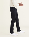 Side view of model wearing Beautiful Black Men's Skinny Fit Original Chino Pants.