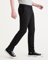 Side view of model wearing Beautiful Black Men's Skinny Fit Smart 360 Flex California Chino Pants.