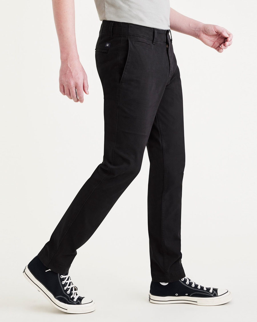 Side view of model wearing Beautiful Black Men's Skinny Fit Smart 360 Flex California Chino Pants.