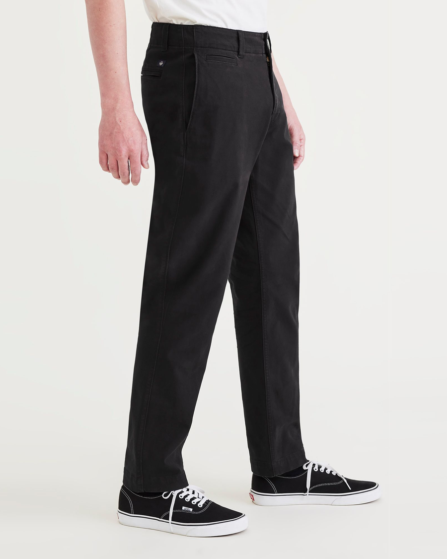 Side view of model wearing Beautiful Black Men's Slim Fit Smart 360 Flex California Chino Pants.
