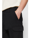 View of model wearing Beautiful Black Men's Slim Tapered Fit Cargo Pants.