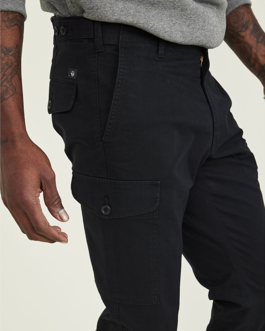 View of model wearing Beautiful Black Men's Slim Tapered Fit Cargo Pants.