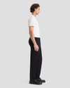 Side view of model wearing Beautiful Black Men's Straight Fit Original Chino Pants.
