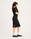 Side view of model wearing Beautiful Black Rib Dress with Lofi Knit, Slim Fit.