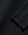 View of model wearing Beautiful Black V Neck Sweater.