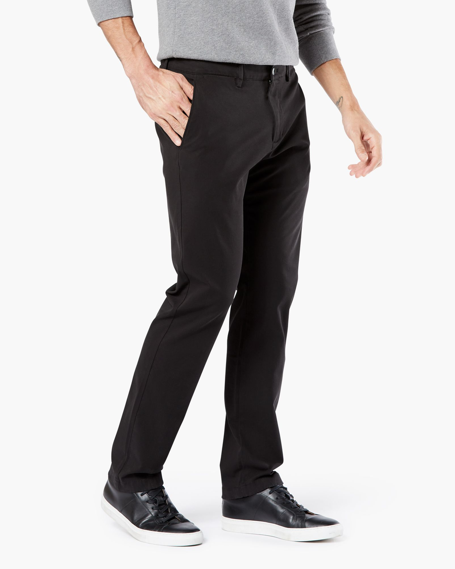 Side view of model wearing Black Big and Tall Tapered Fit Smart 360 Flex Alpha Chino Pants.