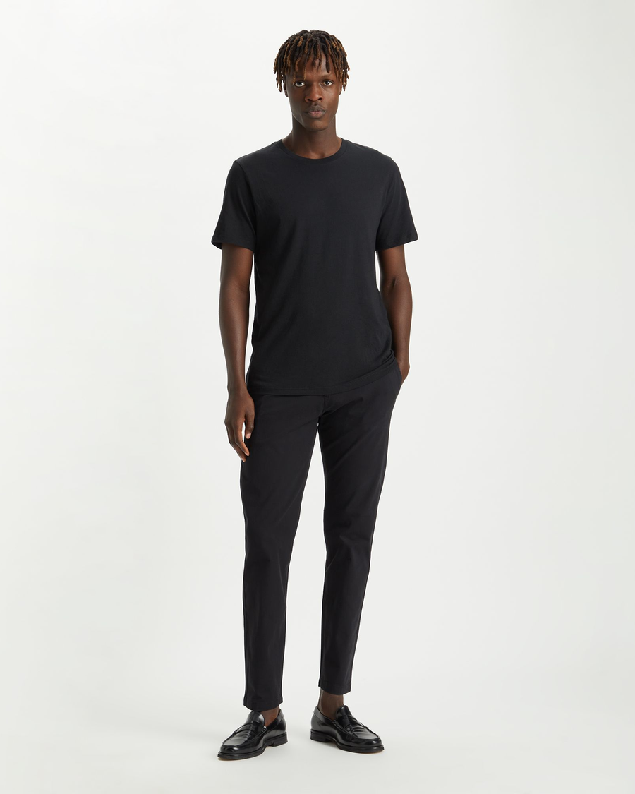 Front view of model wearing Black Crafted Khaki Pants, Slim Tapered Fit.