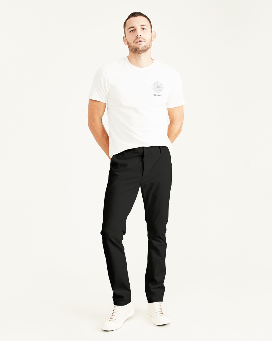 Front view of model wearing Black Men's Skinny Fit Supreme Flex Alpha Khaki Pants.