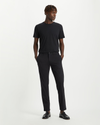 View of model wearing Black Men's Slim Tapered Fit Smart 360 Flex Alpha Chino Pants.