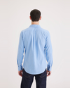 Back view of model wearing Bluefin Men's Slim Fit Icon Button Up Shirt.