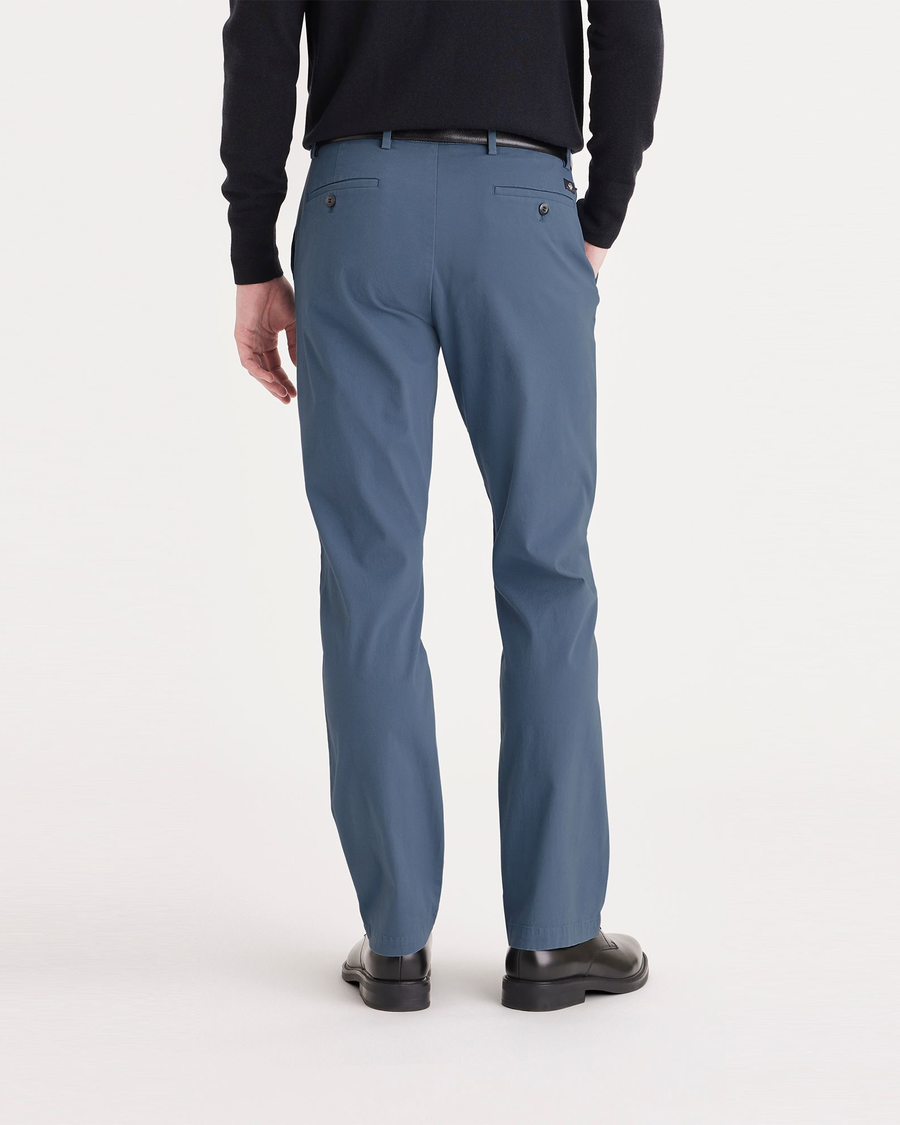 Back view of model wearing Bluefin Men's Slim Fit Smart 360 Flex Alpha Chino Pants.