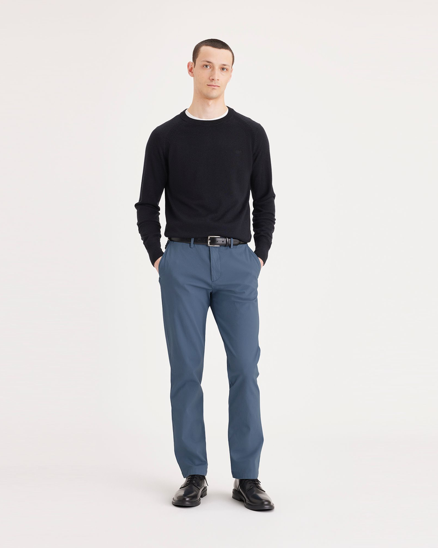 Front view of model wearing Bluefin Men's Slim Fit Smart 360 Flex Alpha Chino Pants.