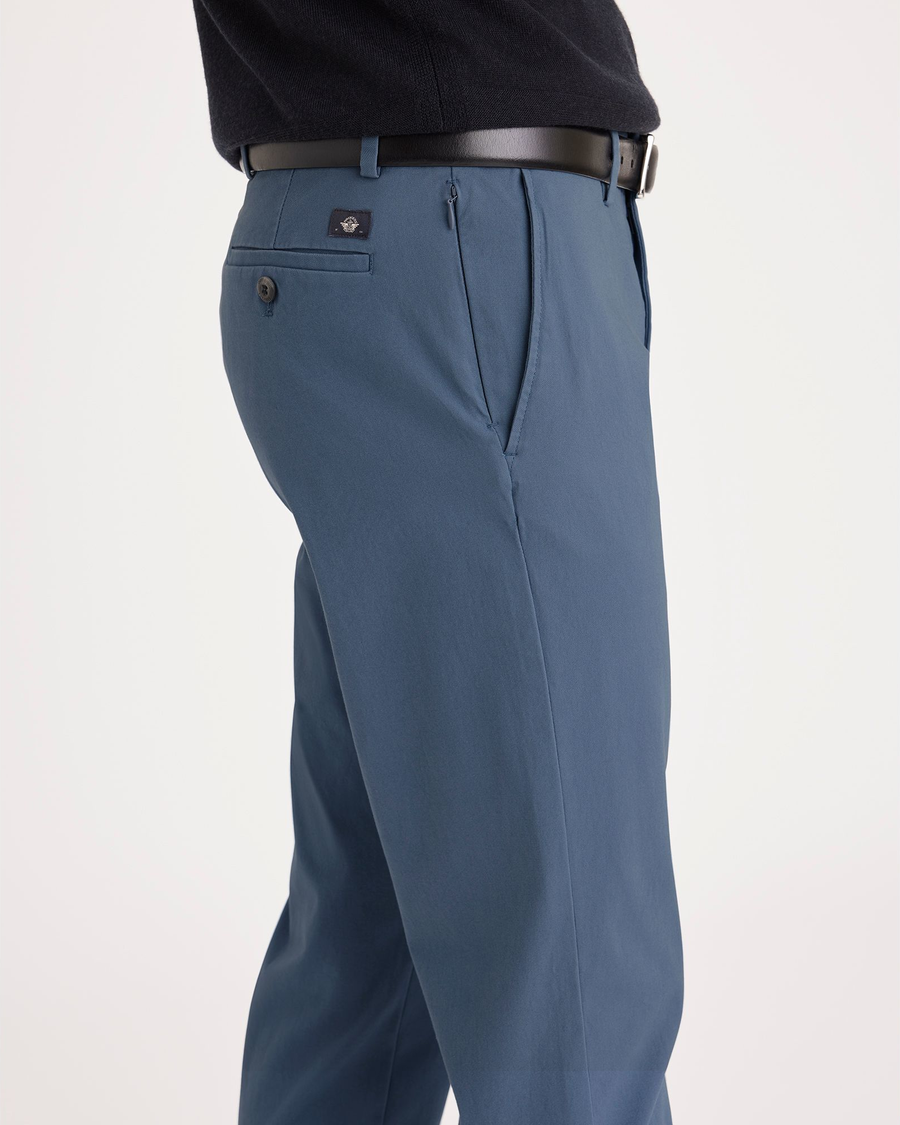 Side view of model wearing Bluefin Men's Slim Fit Smart 360 Flex Alpha Chino Pants.