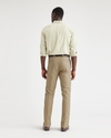 Back view of model wearing British Khaki Men's Slim Fit Smart 360 Flex Workday Khaki Pants.