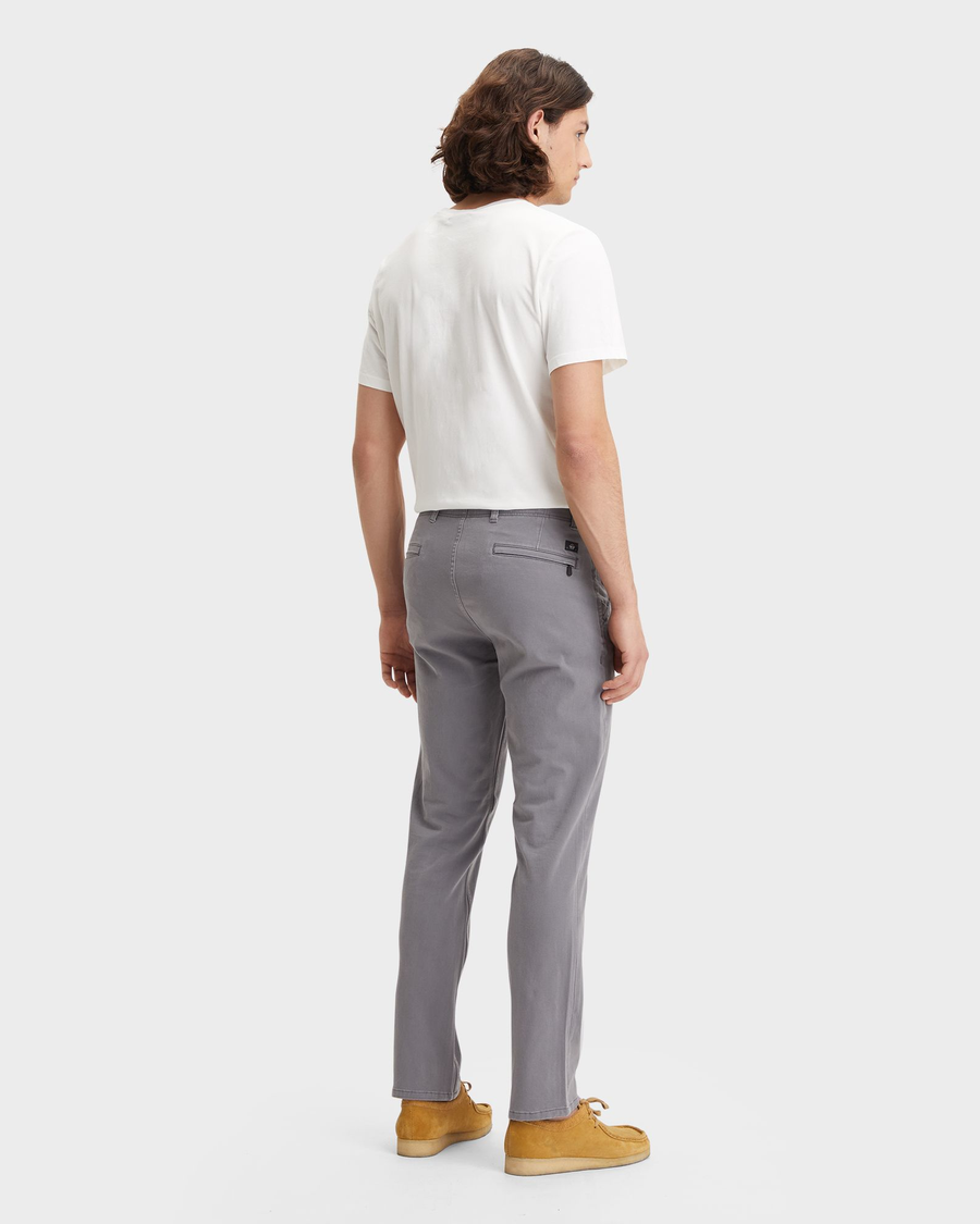 Back view of model wearing Burma Grey Men's Slim Fit Smart 360 Flex Alpha Khaki Pants.