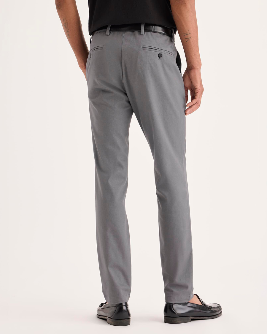 Back view of model wearing Burma Grey Signature Iron Free Khakis, Skinny Fit with Stain Defender®.