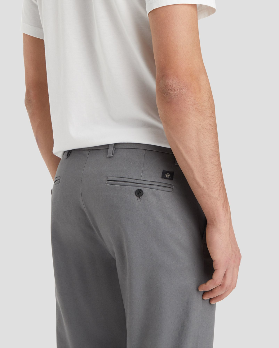 View of model wearing Burma Grey Signature Iron Free Khakis, Slim Fit with Stain Defender®.