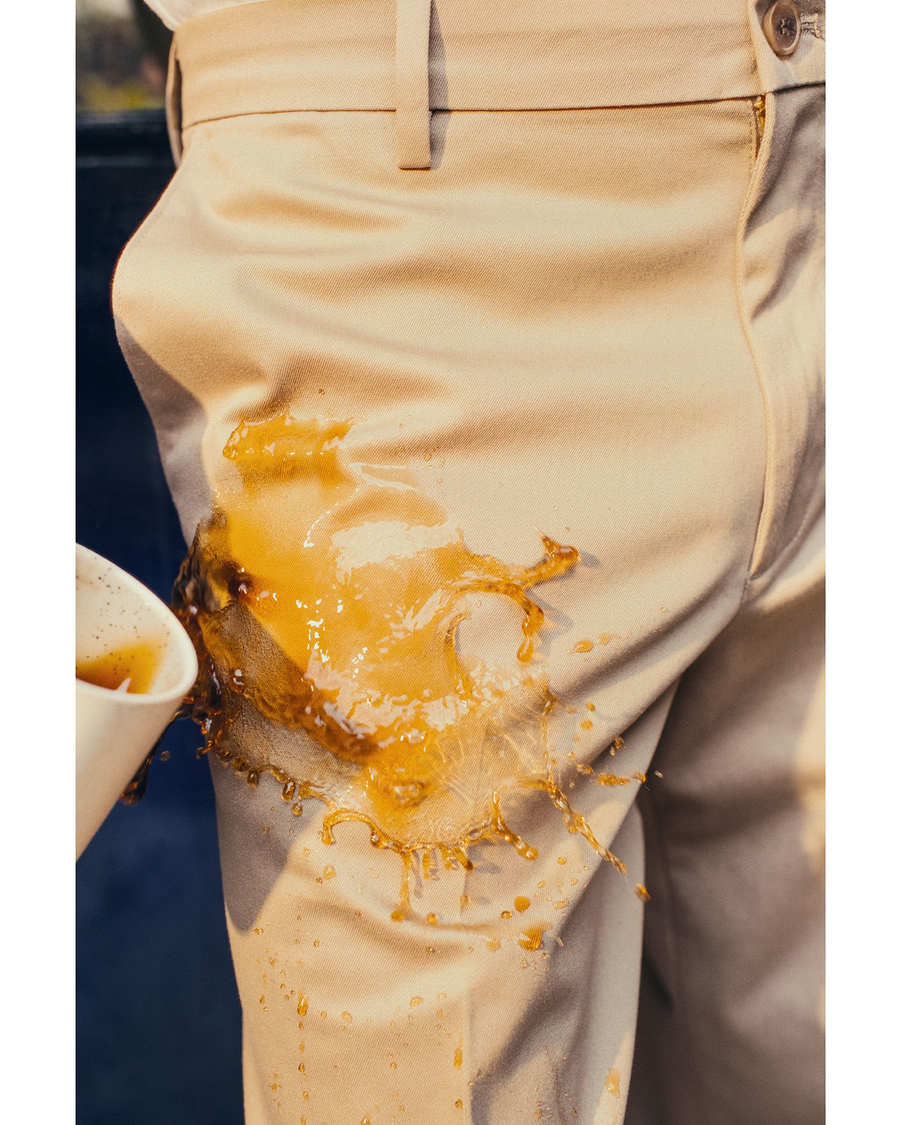 View of model wearing Burma Grey Signature Iron Free Khakis, Slim Fit with Stain Defender®.