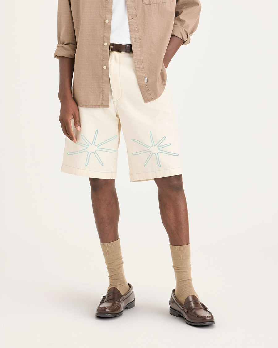 Front view of model wearing Buttercream Men's Loose Fit Eighty-Six Dock 10" Shorts.