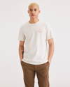 Front view of model wearing Buttercream Men's Slim Fit Logo Tee.