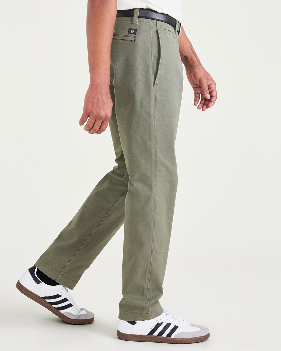 Side view of model wearing Camo Alpha Chino Pants, Slim Fit.