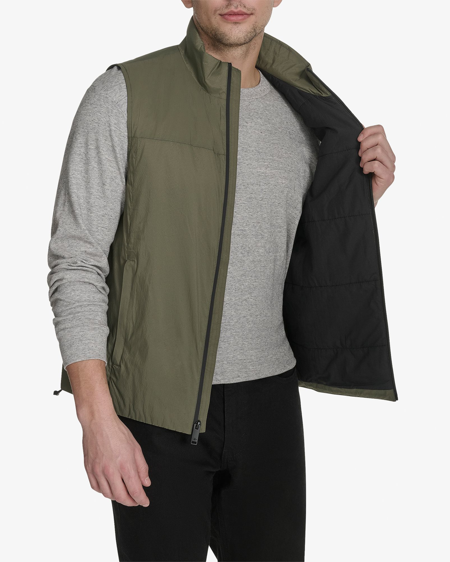 View of model wearing Camo Men's Lightweight Padded Vest.