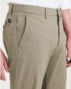 View of model wearing Camo Men's Slim Fit Smart 360 Flex Alpha Chino Pants.