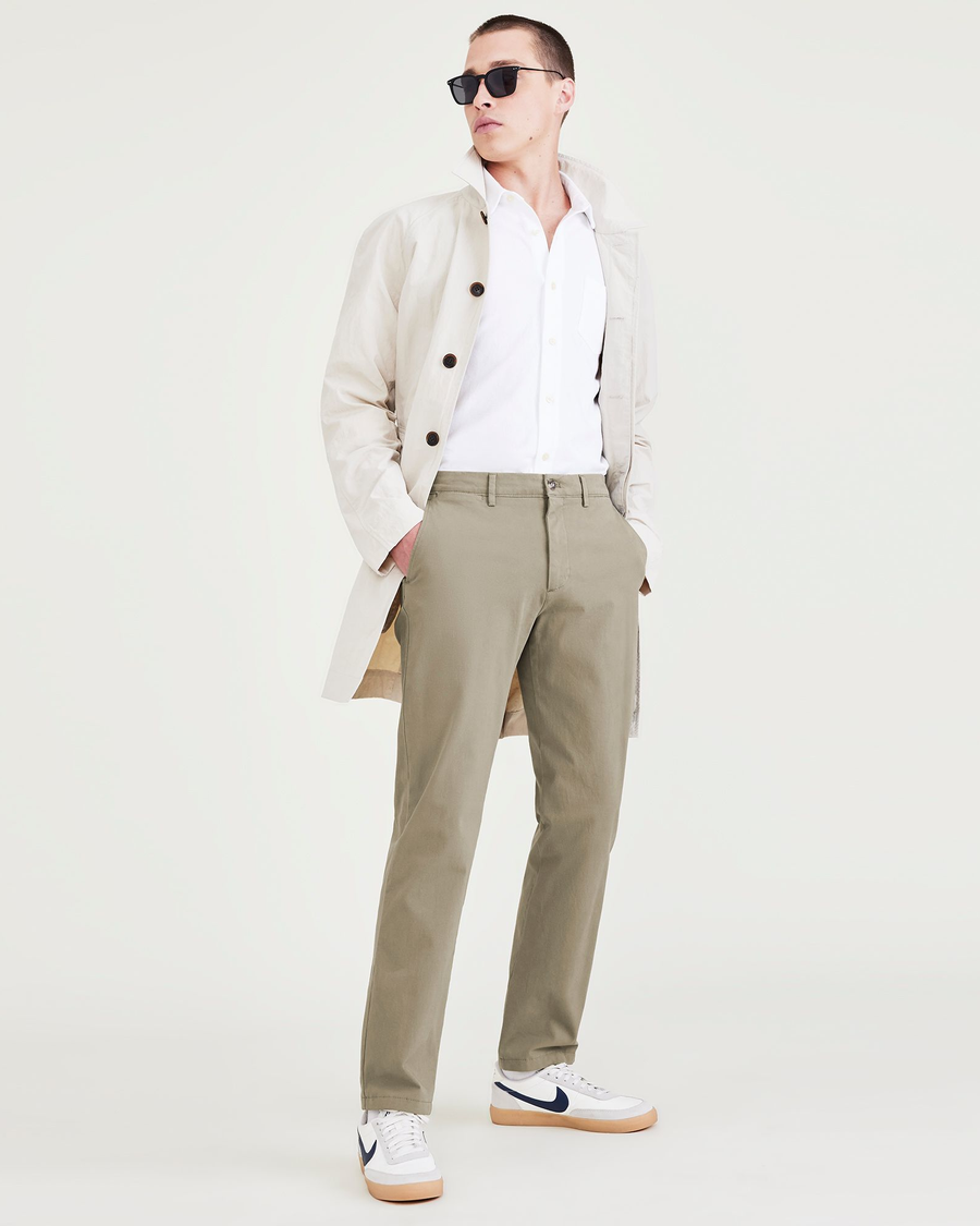 View of model wearing Camo Men's Slim Fit Smart 360 Flex Alpha Chino Pants.