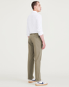Back view of model wearing Camo Men's Slim Fit Smart 360 Flex Alpha Chino Pants.
