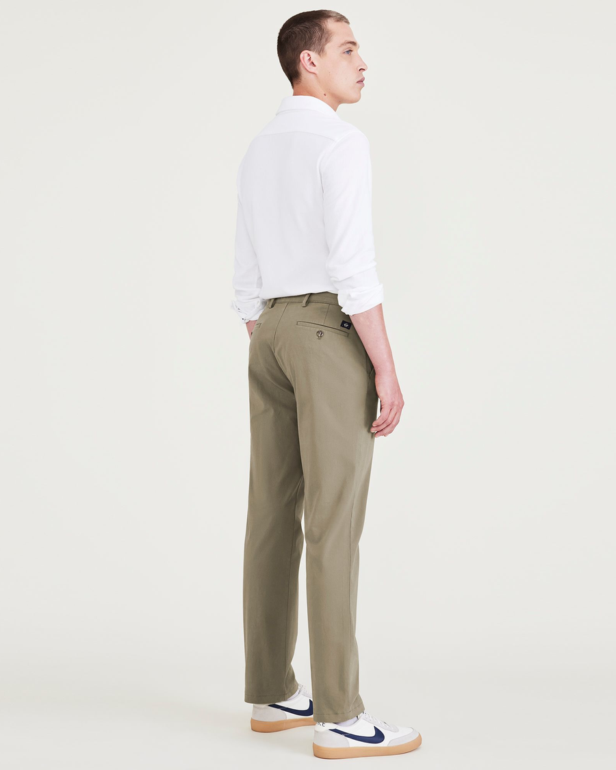 Back view of model wearing Camo Men's Slim Fit Smart 360 Flex Alpha Chino Pants.