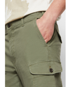 View of model wearing Camo Men's Slim Tapered Fit Cargo Pants.