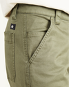 View of model wearing Camo Men's Straight Fit Utility Pants.