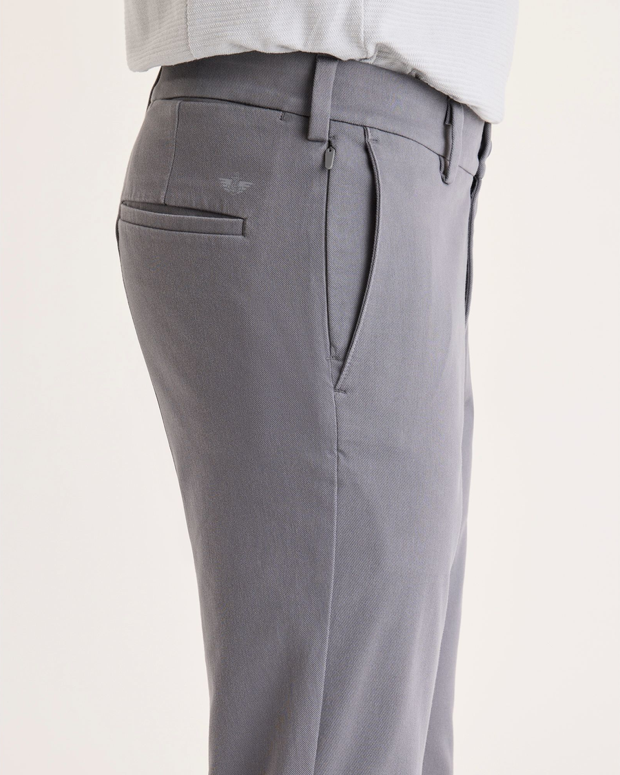 Side view of model wearing Car Park Grey Chino Go Activeflex, fit skinny.