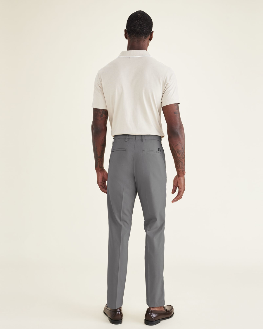 Back view of model wearing Car Park Grey Men's Slim Fit Signature Go Khaki Pants.