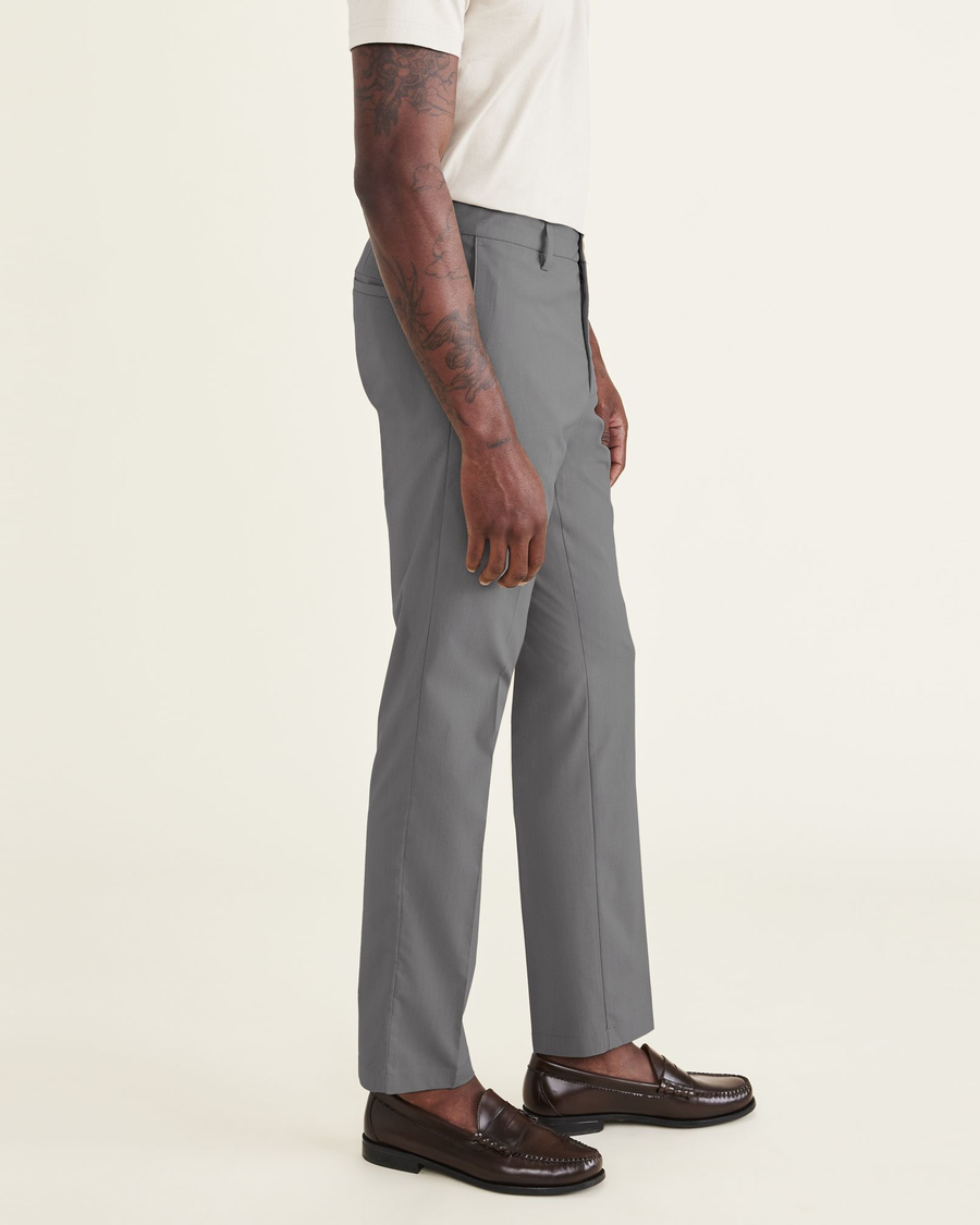 Side view of model wearing Car Park Grey Men's Slim Fit Signature Go Khaki Pants.