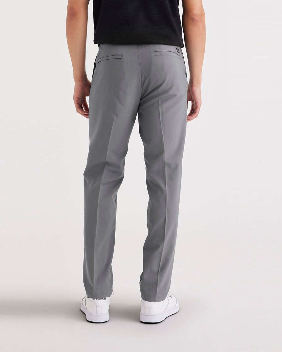 Back view of model wearing Car Park Grey Signature Go Khaki Pants, Slim Fit.