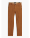 Front view of model wearing Caramel Café Men's Slim Fit Smart 360 Flex Ultimate Chino Pants.